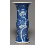A CHINESE BLUE AND WHITE BEAKER SHAPED VASE, PAINTED WITH PRUNUS ON A CRACKED ICE GROUND, 34CM H,
