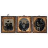 THREE VICTORIAN WET COLLODION POSITIVE (AMBROTYPE) PHOTOGRAPHS OF A COUPLE AND GROUPS, EACH WITH