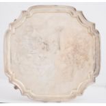 A GEORGE V SILVER SALVER, SHAPED SQUARE, ON FOUR VOLUTE FEET, 30.5 X 30.5CM, BY S BLANCKENSEE & SONS