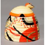 CLARICE CLIFF. AN A J WILKINSON CARPET BEE SKEP HONEY JAR AND A COVER, 1930, 9CM H, PRINTED BIZARRE