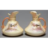 TWO LOCKE & CO WORCESTER PAIR SHAPED EWERS, C1902-14, PAINTED WITH A BIRD ON A RAISED GILT BRANCH,