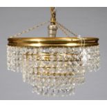 A GILTMETAL AND GLASS CONCENTRIC CASCADE CHANDELIER, 20TH C, 27CM DIA Basically complete and in good