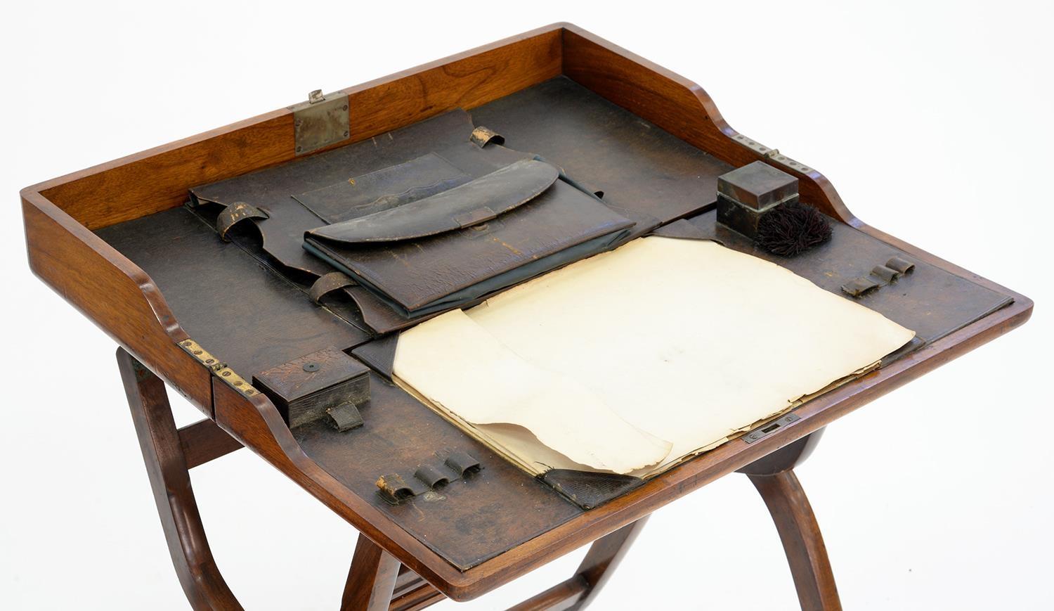 CAMPAIGN FURNITURE. AN EDWARDIAN MAHOGANY FOLDING WRITING TABLE WITH BLUE LEATHER FITTED INTERIOR, - Image 2 of 2