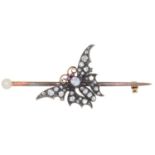 A DIAMOND BUTTERFLY BROOCH, C1900, WITH RUBY CABOCHON EYES, MOUNTED ON A GOLD PIN WITH CULTURED