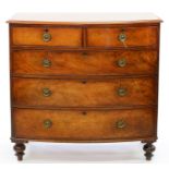 A VICTORIAN MAHOGANY BOW FRONTED CHEST OF DRAWERS ON TURNED FEET, 105CM H; 107 X 53CM Small split to