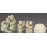 THREE CHINESE GREEN HARDSTONE CARVINGS OF BOYS, 54MM H AND SMALLER AND ANOTHER STONE CARVING OF DEER