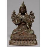 A TIBETAN BRONZE SCULPTURE OF A BODHISATTVA, SEALED, 21.5CM H Much accretion of dirt and grime,