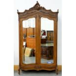 A FRENCH CARVED WALNUT ARMOIRE, EARLY 20TH C, 240CM H; 35 X 47CM Some signs of old worm damage, some
