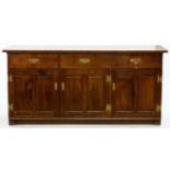 AN ANTIQUE STYLE CARVED AND PANELLED OAK DRESSER BASE, 83CM H; 75 X 51CM