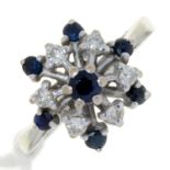 A SAPPHIRE AND DIAMOND CLUSTER RING, IN 18CT WHITE GOLD, BIRMINGHAM 1975, 4.4G, SIZE M½ Good