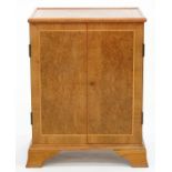 A VICTORIAN STYLE WALNUT CUPBOARD ON SPLAYED BRACKET FEET, 93CM H; 70 X 51CM Some fading, heavy in