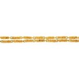A GOLD NECKLACE OF TEXTURED BATONS, 77CM L, INCOMPLETELY MARKED, MAKER'S MARK J D (?), LONDON