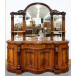 A VICTORIAN MAHOGANY SERPENTINE MIRROR BACKED SIDEBOARD, THE LOWER PART ENCLOSED BY PANELLED