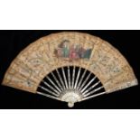 A FAN, EARLY 19TH CENTURY, THE SILK LEAF PAINTED WITH CARD PLAYERS AND FLOWERS, FRAMED BY FESTOONS