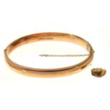 A 9CT GOLD BANGLE, 63 X 58MM, CHESTER 1918, 7.1G AND A SCRAP GOLD DENTAL CROWN (2) Bangle in good