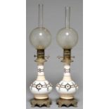 A PAIR OF NORTHERN EUROPEAN MOUNTED GLASS OIL LAMPS, FRENCH OR BELGIAN, LATE 19TH C, OF BOTTLE