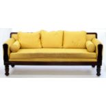 A WILLIAM IV MAHOGANY SOFA ON TURNED LEGS, UPHOLSTERED IN GOLD FABRIC, OF UNUSUALLY DEEP