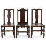 A PAIR OF GEORGE II OAK CHAIRS WITH BOARDED SEAT AND EARLY IRON REPAIRS, SEAT HEIGHT 41CM AND