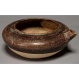 A CHINESE POTTERY POURING VESSEL OF COMPRESED OVOID FORM, THE UPPER HALF INCLUDING THE TAPERED