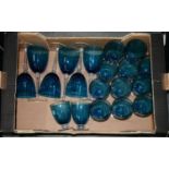 A SUITE OF BLUE GLASS, COMPRISING SIX GOBLETS AND THIRTEEN WATER GLASSES, 20TH C, THE LATTER