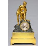 A LOUIS PHILIPPE GILT AND PATINATED BRONZE MANTLE CLOCK 1830-1848, IN THE FORM OF MERCURY, THE NAKED