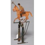 SPORT.  AN UNUSUAL PAINTED SHEET IRON PENDULUM MOBILE OF A POLO PLAYER ON GREEN PAINTED STAND,