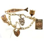 A GOLD CHARM BRACELET WITH A COLLECTION OF GOLD CHARMS AND PADLOCK, APPROX 180MM L, 20.7G Good