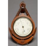 MARITIME INTEREST. A VICTORIAN CARVED OAK ANEROID BAROMETER IN THE FORM OF AN ANCHOR, C1890-1900,