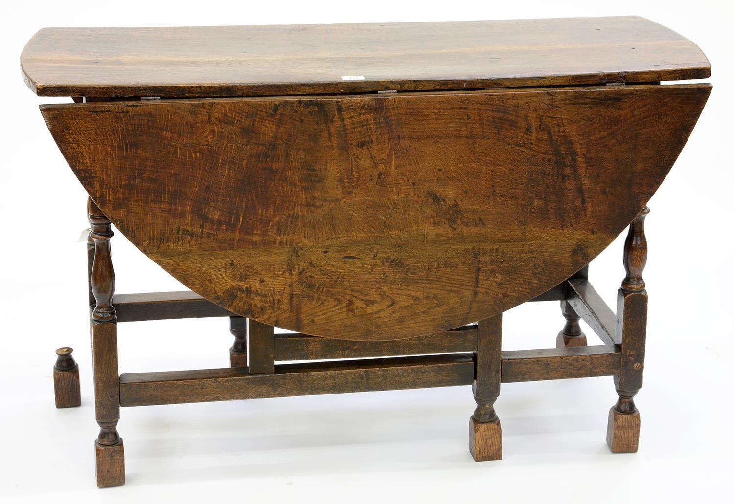 A GEORGE III OAK GATELEG TABLE, 76CM H; 122 X 133CM Some movement to frame, shrinkage crack and some