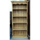 A WAXED PINE OPEN BOOKCASE WITH PANELLED SIDES AND ADJUSTABLE SHELVES, 199CM H; 91 X 40CM