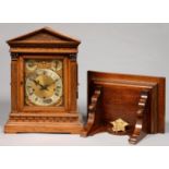A GERMAN OAK ARCHITECTURAL CASED BRACKET CLOCK AND A BRACKET, LATE 19TH C, HAVING BRASS DIAL WITH
