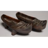 A PAIR OF SPANISH CARVED AND STAINED WOOD CLOGS, 19TH/EARLY 20TH C, 31CM L Good condition