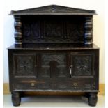 A VICTORIAN ANTIQUARIAN TASTE CARVED AND DARK STAINED OAK SIDEBOARD, LATE 19TH C, INCORPORATING