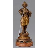 A FRENCH FIN DE SIECLE GILT AND SILVER PATINATED AND BRONZED SPELTER STATUETTE OF A TURK, C1900,