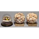 A VICTORIAN FLOWER BASKET ORNAMENT OF PAINTED SEASHELLS, FABRIC AND GYPSUM ON AFFIXED EBONISED