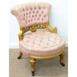 A VICTORIAN GILTWOOD NURSING CHAIR, C1870, THE FLARED BACK AND ROUND SEAT RECOVERED IN BUTTONED PINK