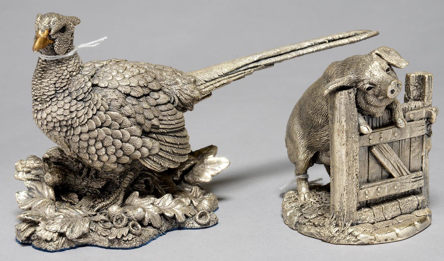 AN ELIZABETH II ELECTROFORMED AND FILLED SILVER MODEL OF A PIG AT A GATE AND A LARGER SIMILAR