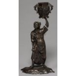 A JAPANESE BRONZE OKIMONO OF A WOMAN HOLDING ALOFT A VESSEL, MEIJI PERIOD, RICH REDDISH BROWN