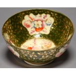 A DERBY GREEN GROUND BOWL, C1830, BOLDLY PAINTED INSIDE AND OUT WITH PANELS OF FLOWERS AND RICHLY
