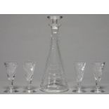 AN ART DECO WEBB CORBETT CUT GLASS DECANTER, STOPPER AND FOUR GLASSES, DESIGNED BY IRENE STEVENS,