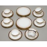 A SET OF EIGHT ROYAL CROWN DERBY COBALT AND GILT TEA CUPS, SAUCERS AND SIDE PLATES, 1900, WITH