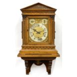 A GERMAN OAK ARCHITECTURAL CASED BRACKET CLOCK AND A BRACKET, LATE 19TH C, HAVING BRASS DIAL WITH