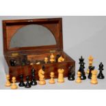 A STAUNTON PATTERN BOXWOOD AND BLACK PAINTED CHESS SET, EARLY 20TH C, KINGS 80MM H, IN A 19TH C