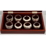 A SET OF SIX OMANI SILVER NAPKIN RINGS, LATE 20TH C, SEVERAL STUDDED WITH RED PASTES, UNMARKED,