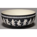 A WEDGWOOD BLACK JASPER DIP BOWL, 20TH C, ORNAMENTED WITH THE DANCING HOURS, 26CM DIA, IMPRESSED