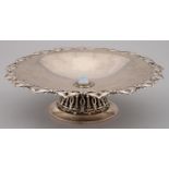 A CONTINENTAL SILVER DISH, C1910, SET TO THE CENTRE WITH SEMI OPALESCENT GLASS CABOCHON IN APPLIED