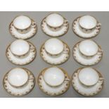 A SET OF NINE WEDGWOOD COBALT AND GILT BONE CHINA TEA CUPS AND SAUCERS, EARLY 20TH C, WITH A NEO