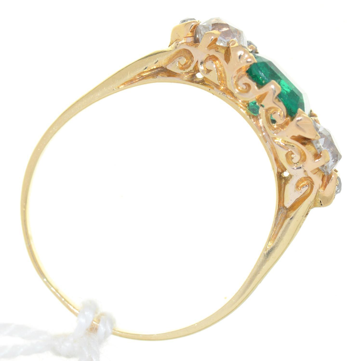 AN EMERALD AND DIAMOND THREE STONE RING,  THE STEP CUT EMERALD FLANKED BY CUSHION SHAPED OLD CUT - Image 2 of 2