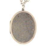 A VICTORIAN SILVER LOCKET, ONE SIDE ENGRAVED WITH DIAPER THE OTHER WITH FLOWERS, 36 X 48MM,