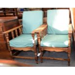 A PAIR OF OAK ARMCHAIRS WITH ADJUSTABLE LADDER BACK, C1930 Consistent with age